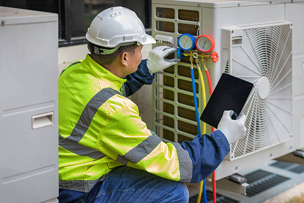 Professional Heat Pump Repair technician working in Aztec, NM